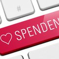 Spendenbutton auf Computertastatur